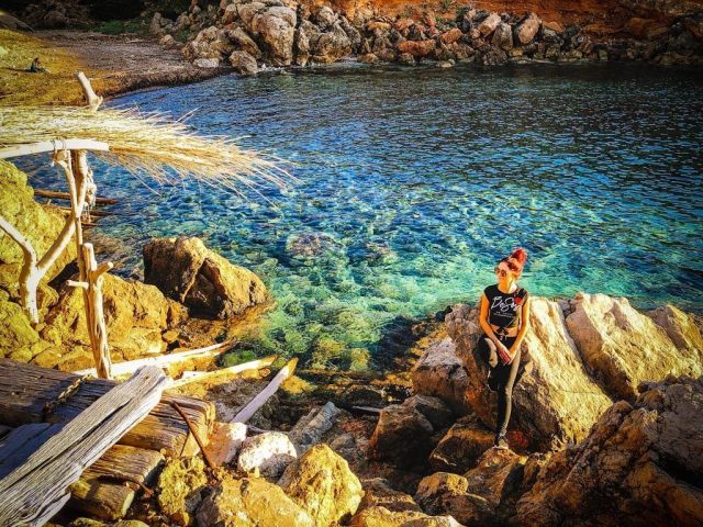 Girl enjoying secret cala at Ibiza