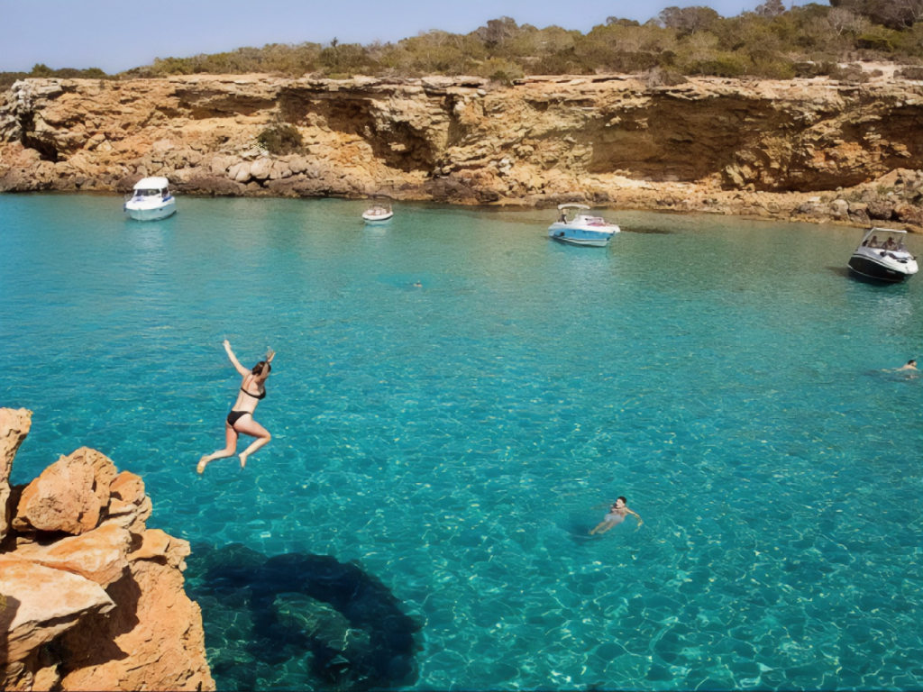 Cruise Tour through the Secret Coves of Ibiza with Paddle Boarding, Snorkeling and Gastronomy.